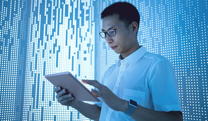 Asian man using tablet