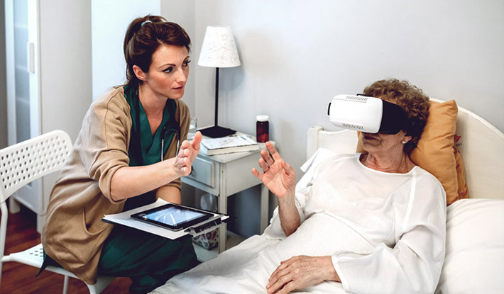 Doctor with digital tablet talking to patient with AR