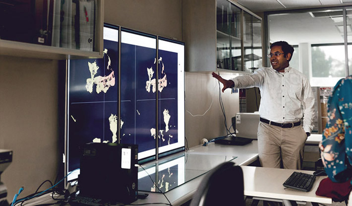 Man giving presentation using display screen