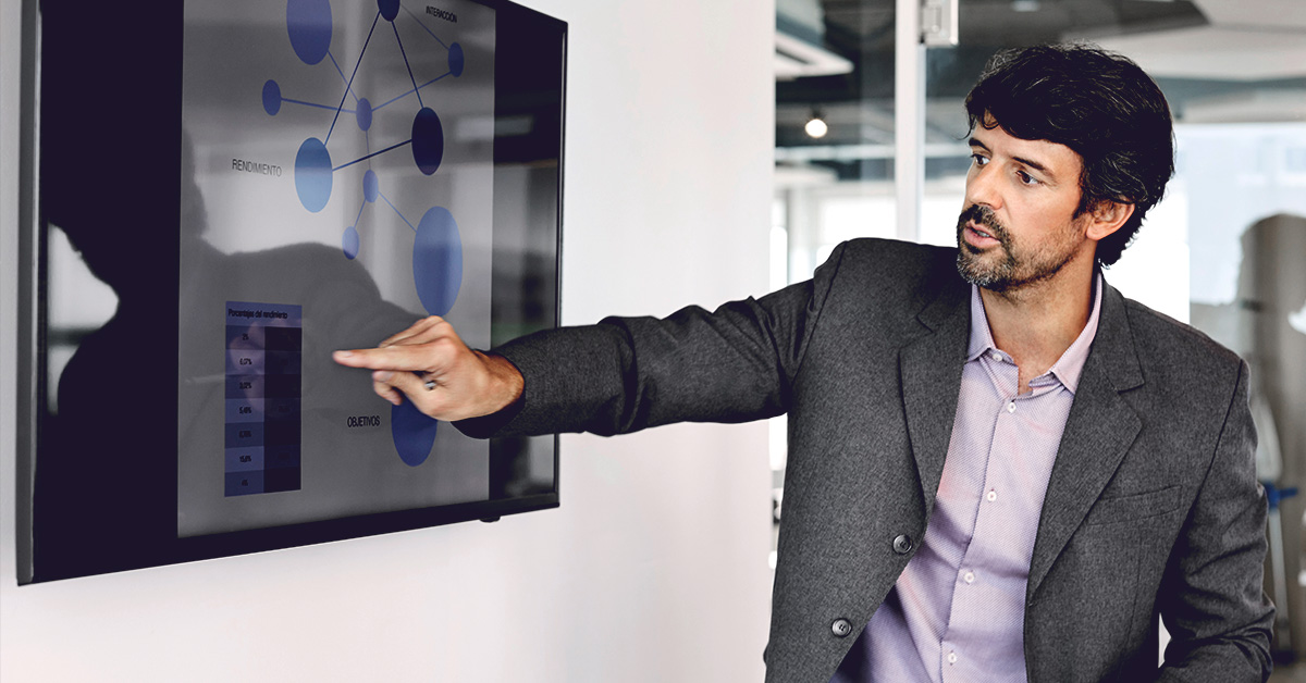 Businesswoman looking at cell phone