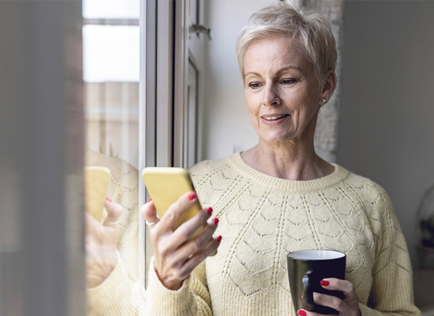 Woman in office using a smartphone