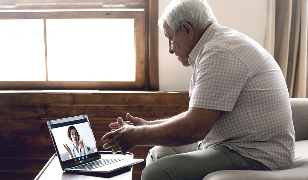 Senior-man-consulting-female-doctor-on-laptop.jpg