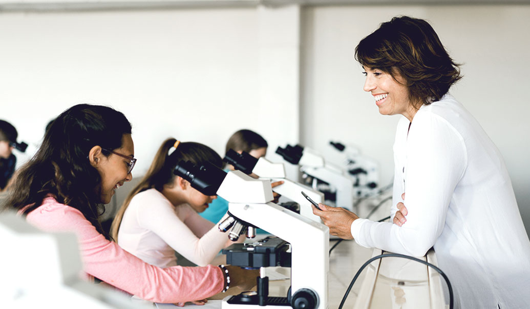 Students looking through microscope