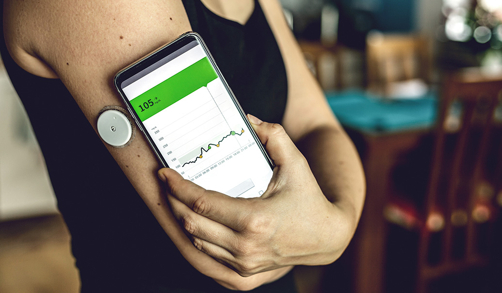 Woman-checking-glucose-level-with-a-modern-technology