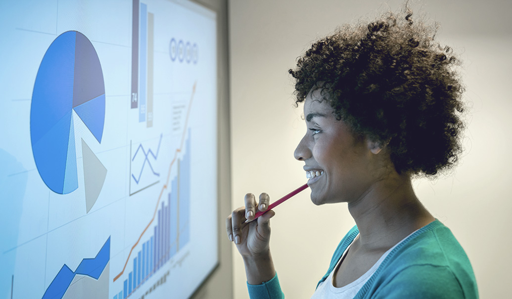 Woman understanding pie chart through display screen