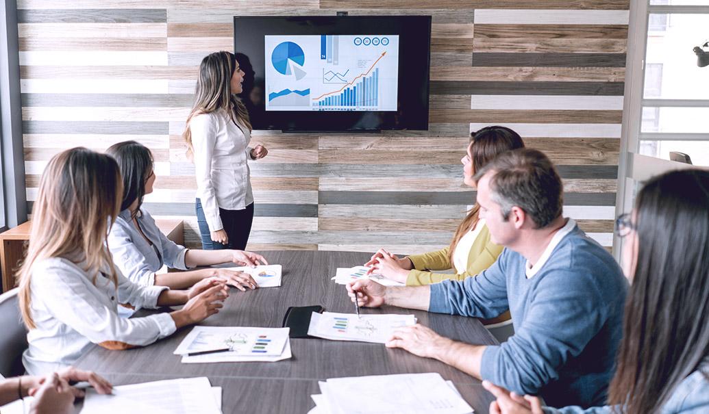 Woman presenting during business meeting