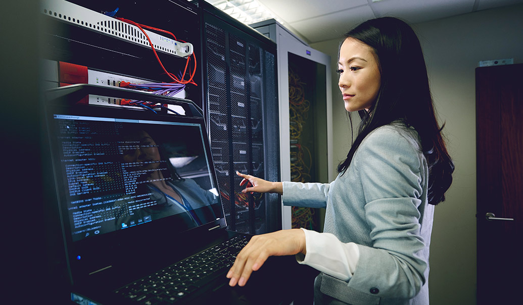 Woman working on server