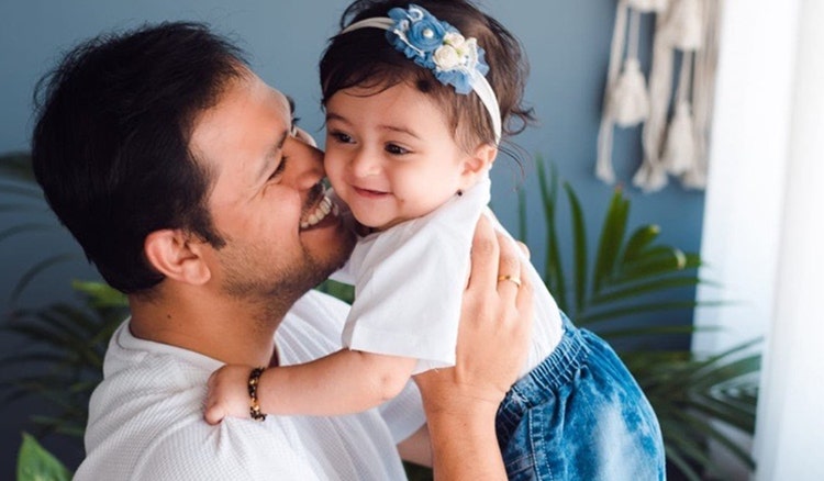 Smiling father and baby girl