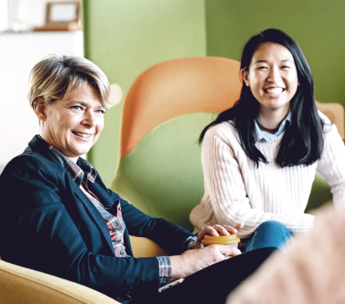 Interns smiling while looking at camera